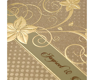 Modern floral Indian wedding card in golden brown colour